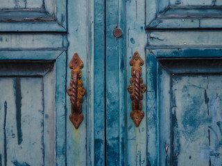 vintage blue door with handles