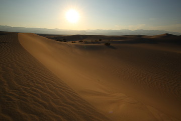 Fototapeta na wymiar Death Valley Sunset at the Mesquite Flat Sand Dunes