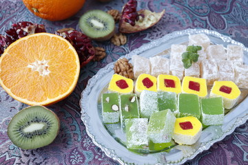 Fototapeta na wymiar Turkish Delight. Turkish sweets and fresh fruit.