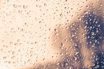 Drops on sweaty glass, abstract background
