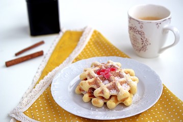 Crispy corn wafers sprinkled with powdered sugar