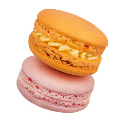 Macaron orange, raspberry and peach isolated on white background with clipping path