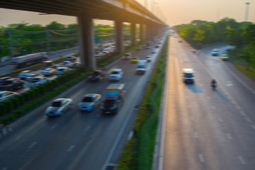 Blurry images of cars speeding on the road.