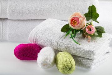 Fototapeta na wymiar Towel concept. Spa concept. Photo for hotels and massage parlors. Purity and softness. Towel textile. 