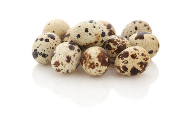 Fototapeta premium pile of quail eggs on white background isolate
