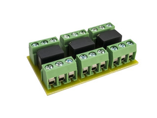Close-up of expansion module of three relays with contacts on the PCB for wires connecting. Green...