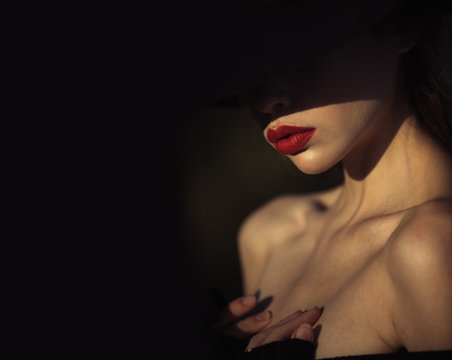 Fototapeta Elegant woman with red lips. elegant woman with naked shoulders on black background, copy space
