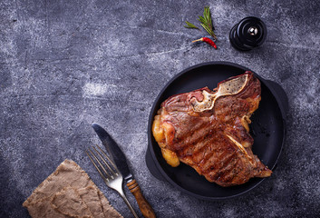 Grilled T-bone steak on dark background