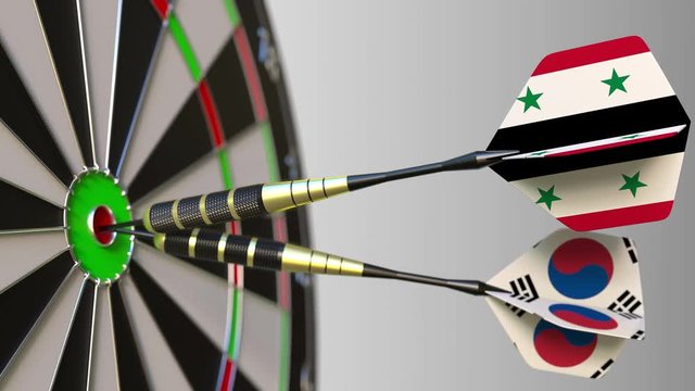 Flags of Syria and Korea on darts hitting bullseye of the target. International cooperation or competition conceptual animation