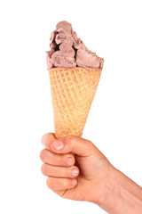 bitten chocolate ice cream in a waffle horn in the hand isolated on a white background