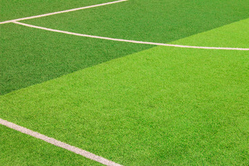 Obraz premium The white Line marking on the artificial green grass soccer field