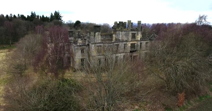 Aerial footage of  the spooky Dunmore Park House, a ruined country mansion in Tudor Gothic style near the village of Airth in Central Scotland.