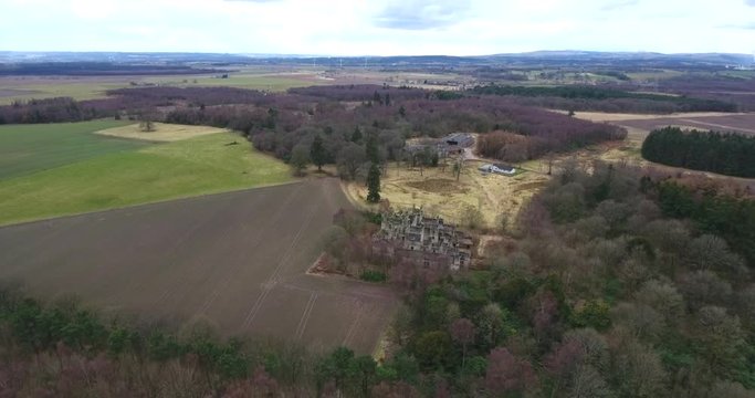 Aerial footage of  the spooky Dunmore Park House, a ruined country mansion in Tudor Gothic style near the village of Airth in Central Scotland.