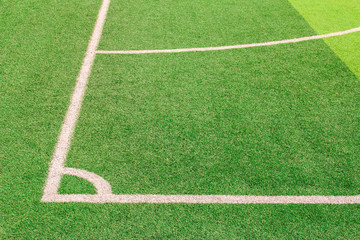 The white Line marking on the artificial green grass soccer field