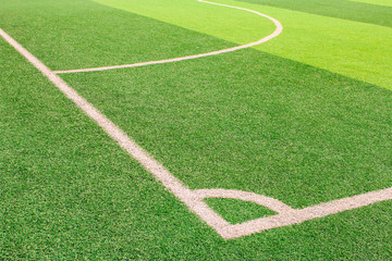 Obraz premium The white Line marking on the artificial green grass soccer field
