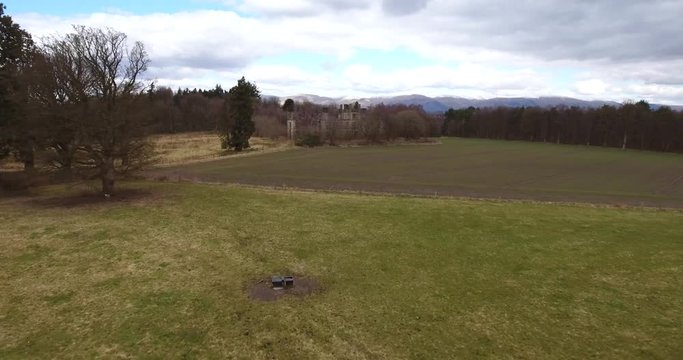 Aerial footage of  the spooky Dunmore Park House, a ruined country mansion in Tudor Gothic style near the village of Airth in Central Scotland.