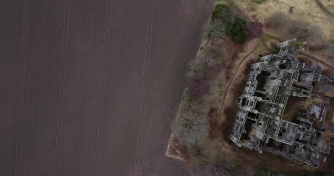 Aerial footage of  the spooky Dunmore Park House, a ruined country mansion in Tudor Gothic style near the village of Airth in Central Scotland.