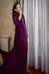 Naklejka premium Beautiful woman speaks by phone