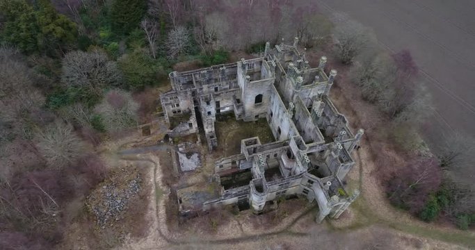 Aerial footage of  the spooky Dunmore Park House, a ruined country mansion in Tudor Gothic style near the village of Airth in Central Scotland.