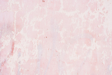 Wall with peeled pink paint - a nice shabby background
