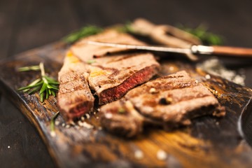Grilled steak on wooden cutting board