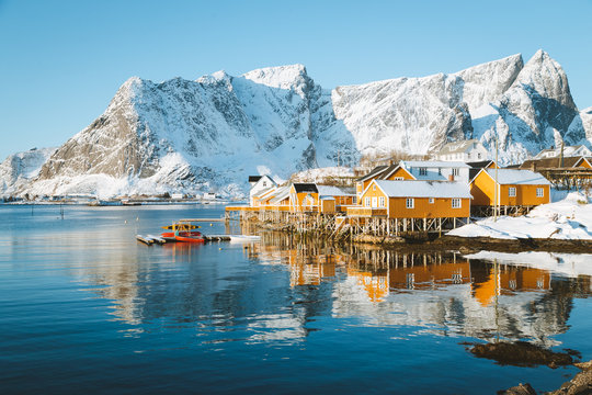 Lofoten Islands winter scenery with traditional fisherman Rorbuer cabins, Sakrisoy, village of Reine, Norway