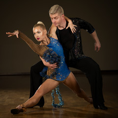 Beautiful professional latin  dance couple preform exhibition dance