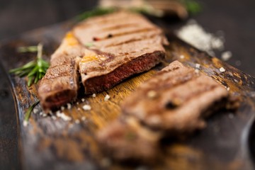 Grilled steak on wooden cutting board