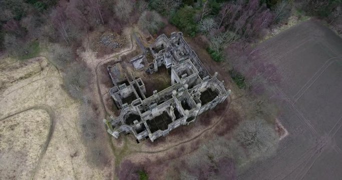 Aerial footage of  the spooky Dunmore Park House, a ruined country mansion in Tudor Gothic style near the village of Airth in Central Scotland.