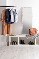 Plakat Modern hallway interior with hanging clothes and shoe rack