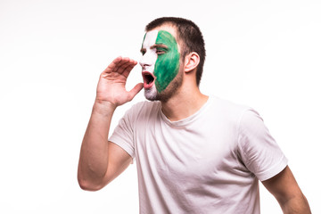Fan support of Nigeria national team with painted face shout solated on white background