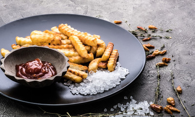 Deep fried french potatoes on dark background