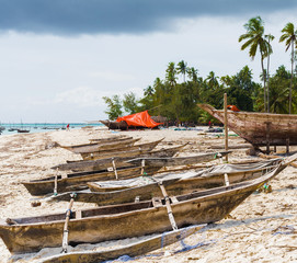 Fototapeta na wymiar traditional african wooden fishing boat on a sandy beach