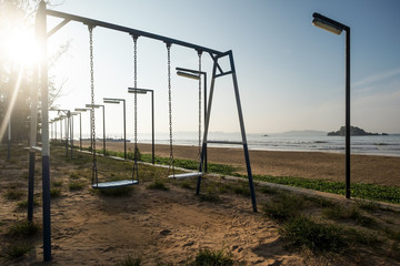 Fototapeta na wymiar Empty swing at the playground on the beach of Weligama Sri Lanka