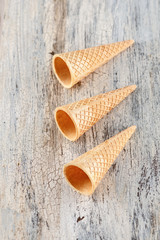 ice cream cones on a wooden background