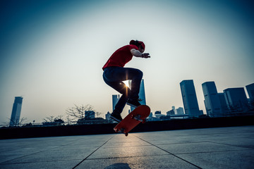 Skateboarder skateboarding at sunrise city © lzf