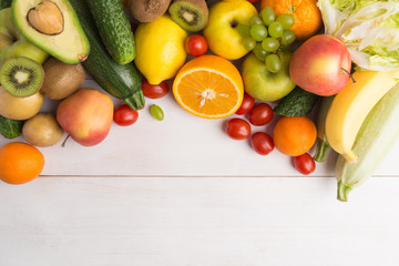 Raw vegetables and fruits with overhead view and copy space