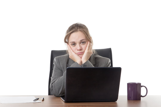 young business woman sitting a her desk