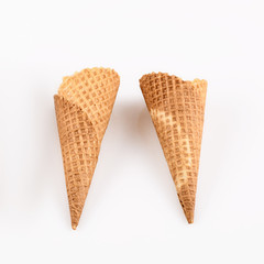 empty ice cream cone on neutral background