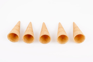 empty ice cream cone on neutral background