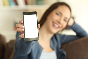 Girl showing a blank smartphone screen to camera