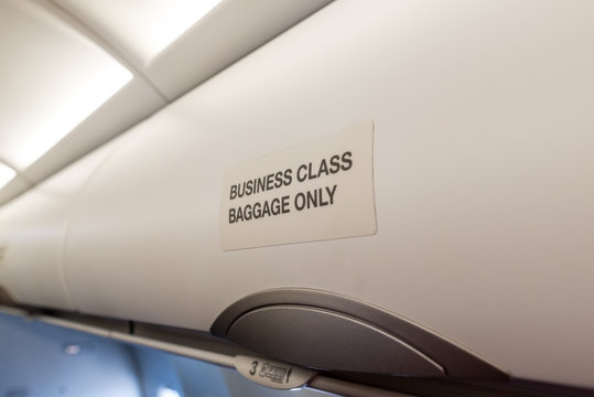 Luggage Shelf In The Aircraft Business Class. Luxury Interior In The Modern Business Jet