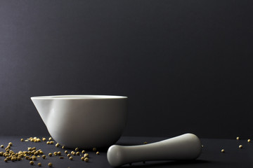 White peper peppercorns in mortar and pestle
