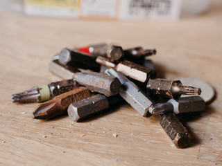 Pile of rusty bits on wooden background