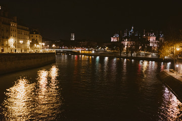Paris river seine at night with reflection of lights