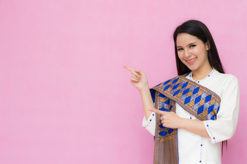 Portrait beautiful Asian girl in traditional Thai dress isolated on pink background. .Cotton Dress