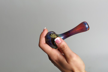 Marijuana pipe in a hand
