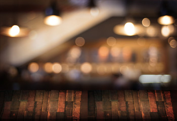 Wooden board empty table  cafe, coffee shop, bar blurred background can be used for display or montage your products and Mock up