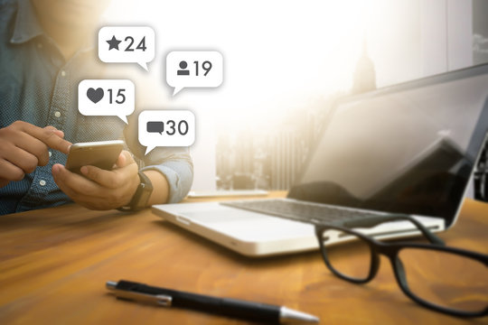 sms media man use  smart phone social media network pop notification icons - Powered by Adobe