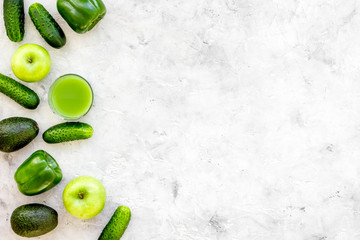 Greeny cocktail ingredients. Fitness smoothie. Cucumber, pepper, apple, avocado on stone background top view space for text